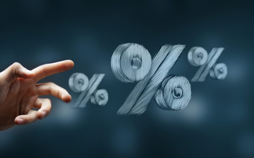 Hand reaching towards floating percentage symbols.